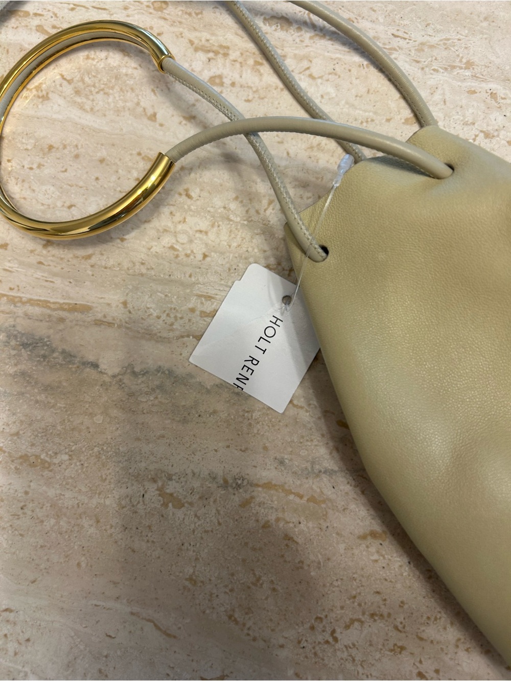 Jil Sander bucket bag pouch with gold wrist ring